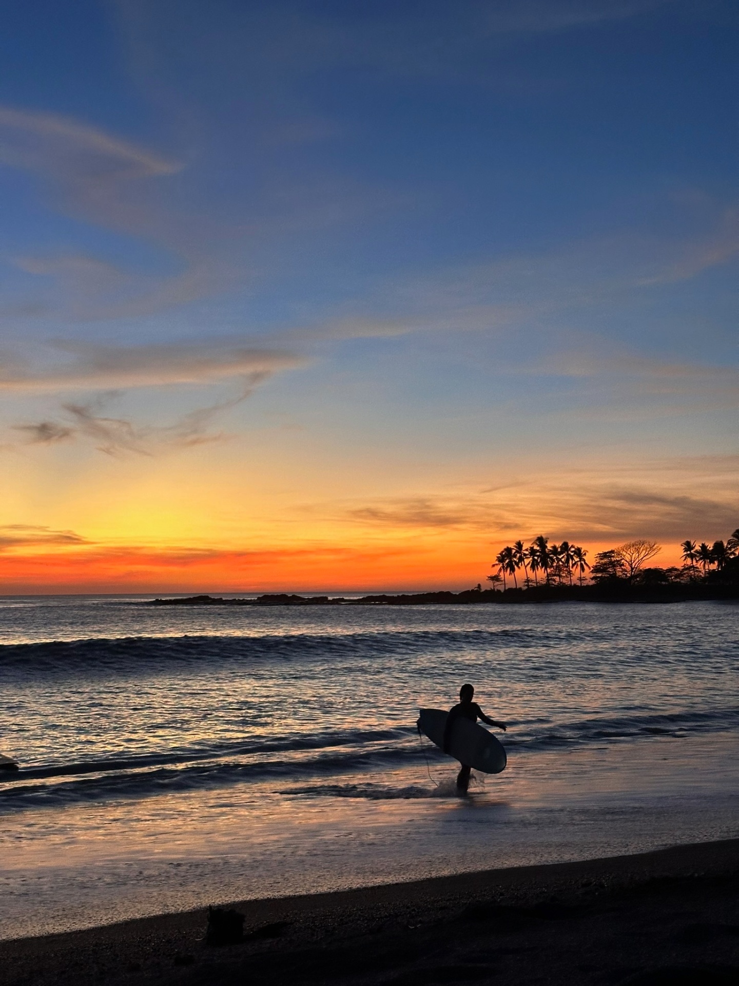 Surfer at sunset on Playa Guiones