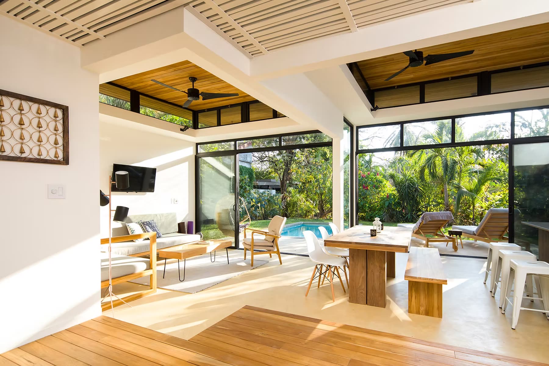 Open-air villa interior with pool view